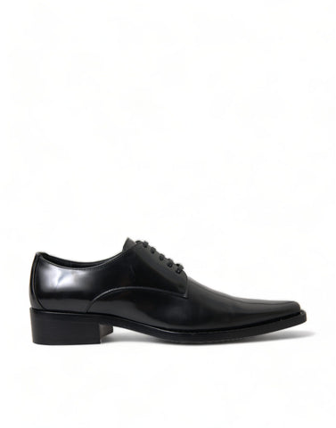 Black leather lace-up formal flats shoes by Dolce & Gabbana, featuring sleek design and polished finish.