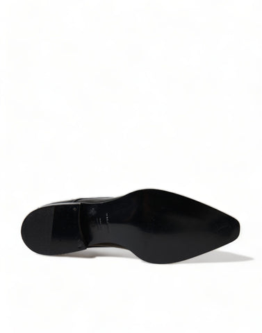 Black leather lace-up formal flats shoes by Dolce & Gabbana, featuring sleek design and polished finish.