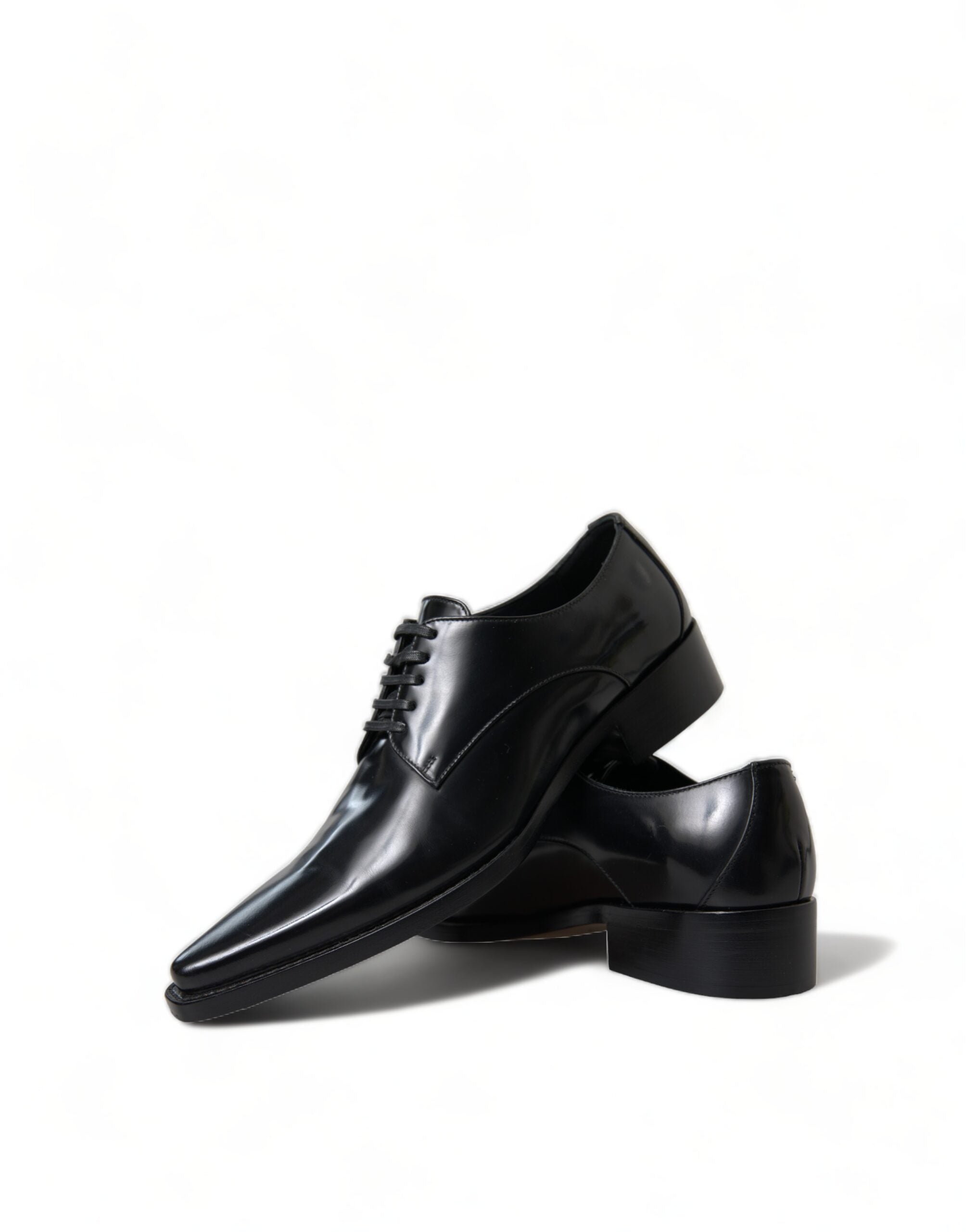 Black leather lace-up formal flats shoes by Dolce & Gabbana, featuring sleek design and polished finish.