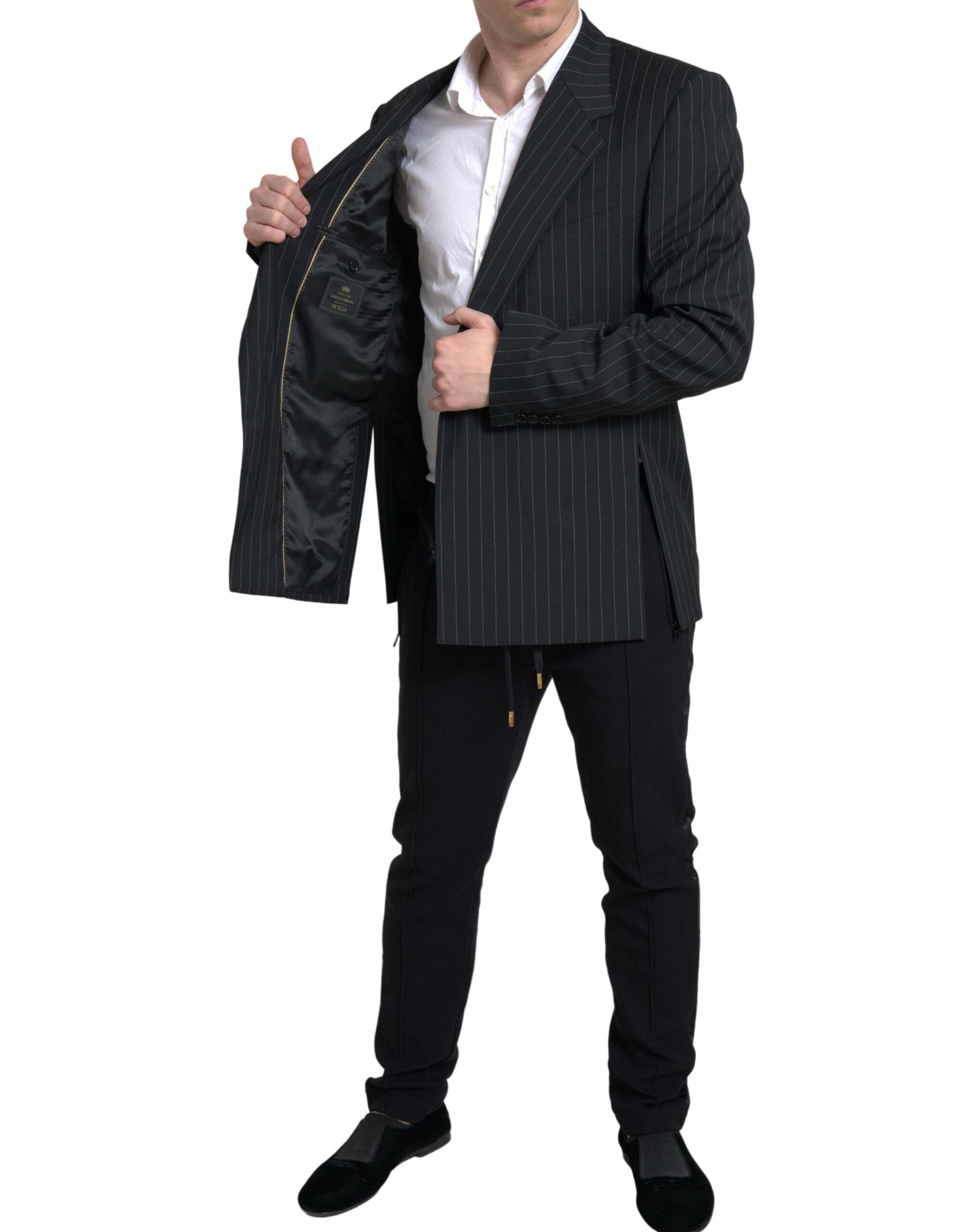 Black Dolce & Gabbana Sicilia blazer with white stripe, single-breasted design, tailored fit, and classic lapel collar.