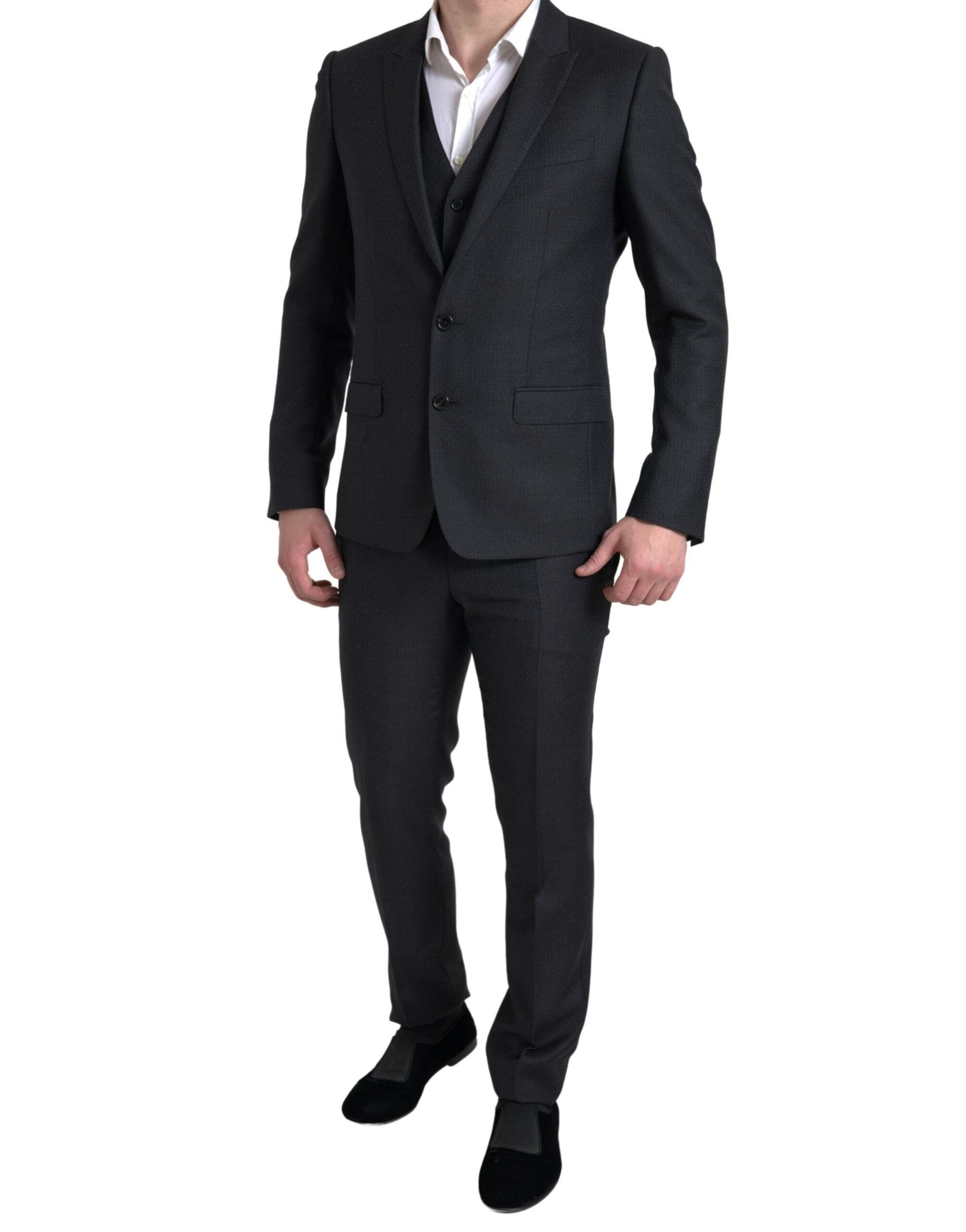 Black 3-piece single-breasted Martini suit by Dolce & Gabbana, featuring tailored jacket, waistcoat, and trousers.