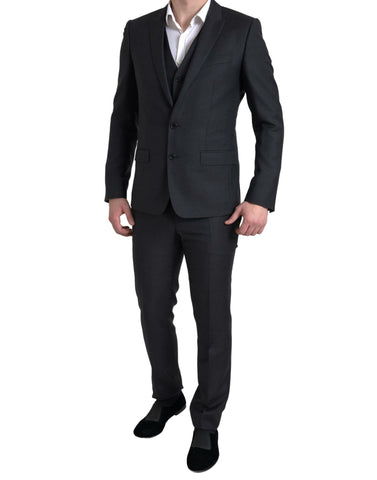 Black 3-piece single-breasted Martini suit by Dolce & Gabbana, featuring tailored jacket, waistcoat, and trousers.