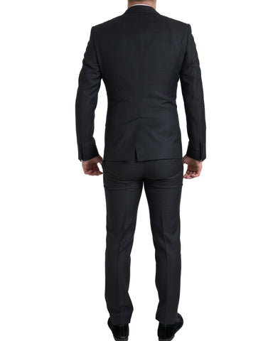 Black 3-piece single-breasted Martini suit by Dolce & Gabbana, featuring tailored jacket, vest, and matching trousers.