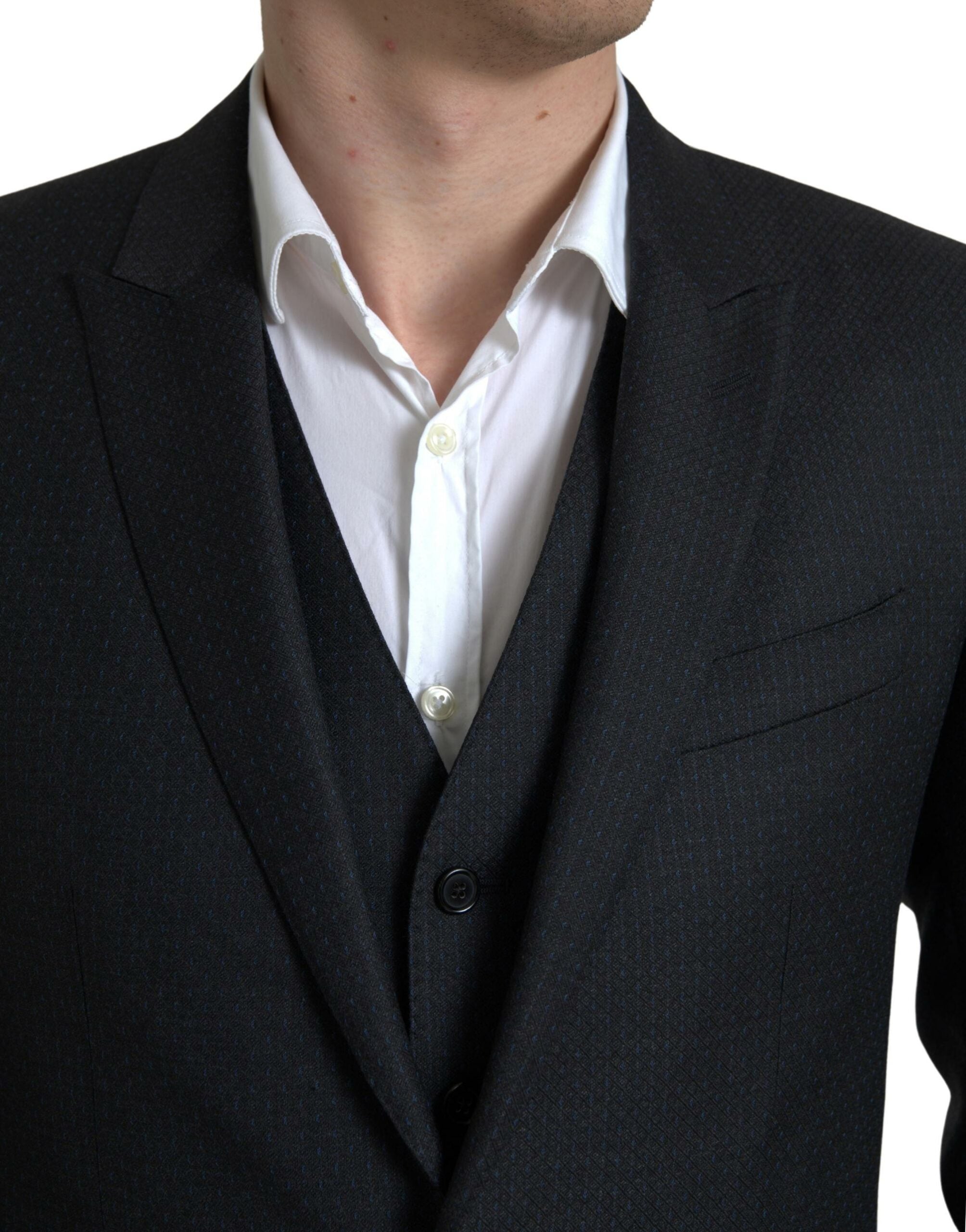 Black 3-piece single-breasted Martini suit by Dolce & Gabbana, featuring tailored jacket, vest, and trousers on a neutral background.