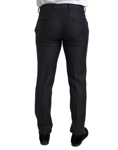 Black Dolce & Gabbana 3-piece single-breasted Martini suit with tailored fit and classic lapels, displayed on a hanger.