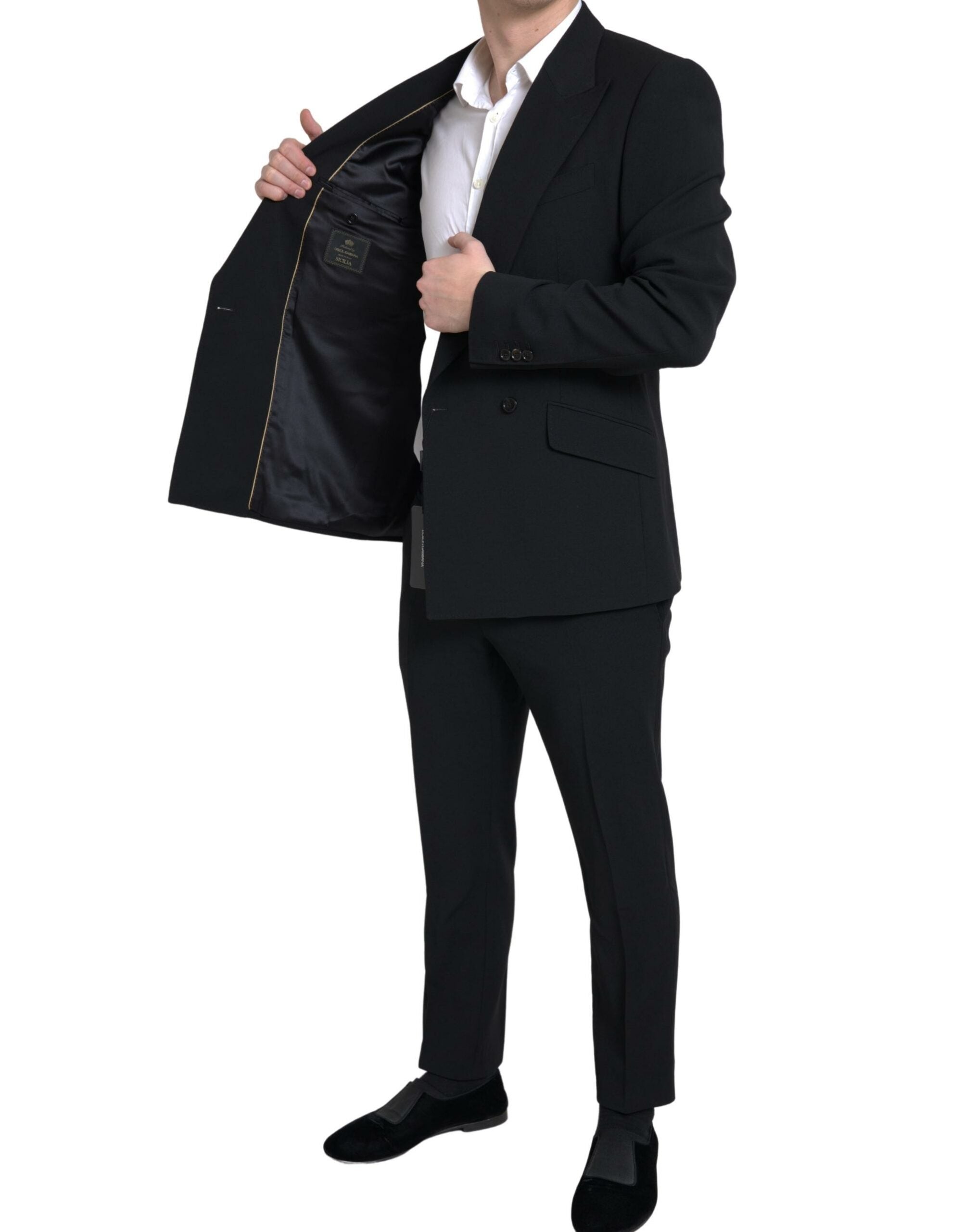 Black Dolce & Gabbana Sicilia 2-piece double-breasted suit, tailored blazer and matching trousers, displayed on a hanger.