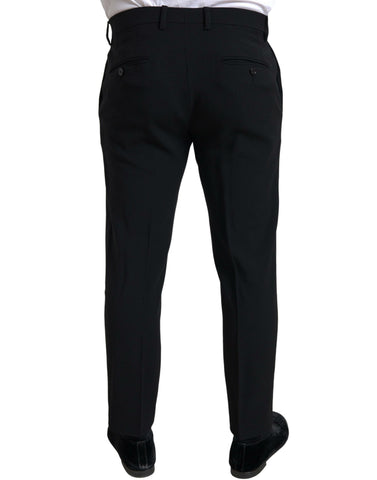 Black Dolce & Gabbana Sicilia 2-piece double-breasted suit, tailored jacket and matching trousers, displayed on a mannequin.