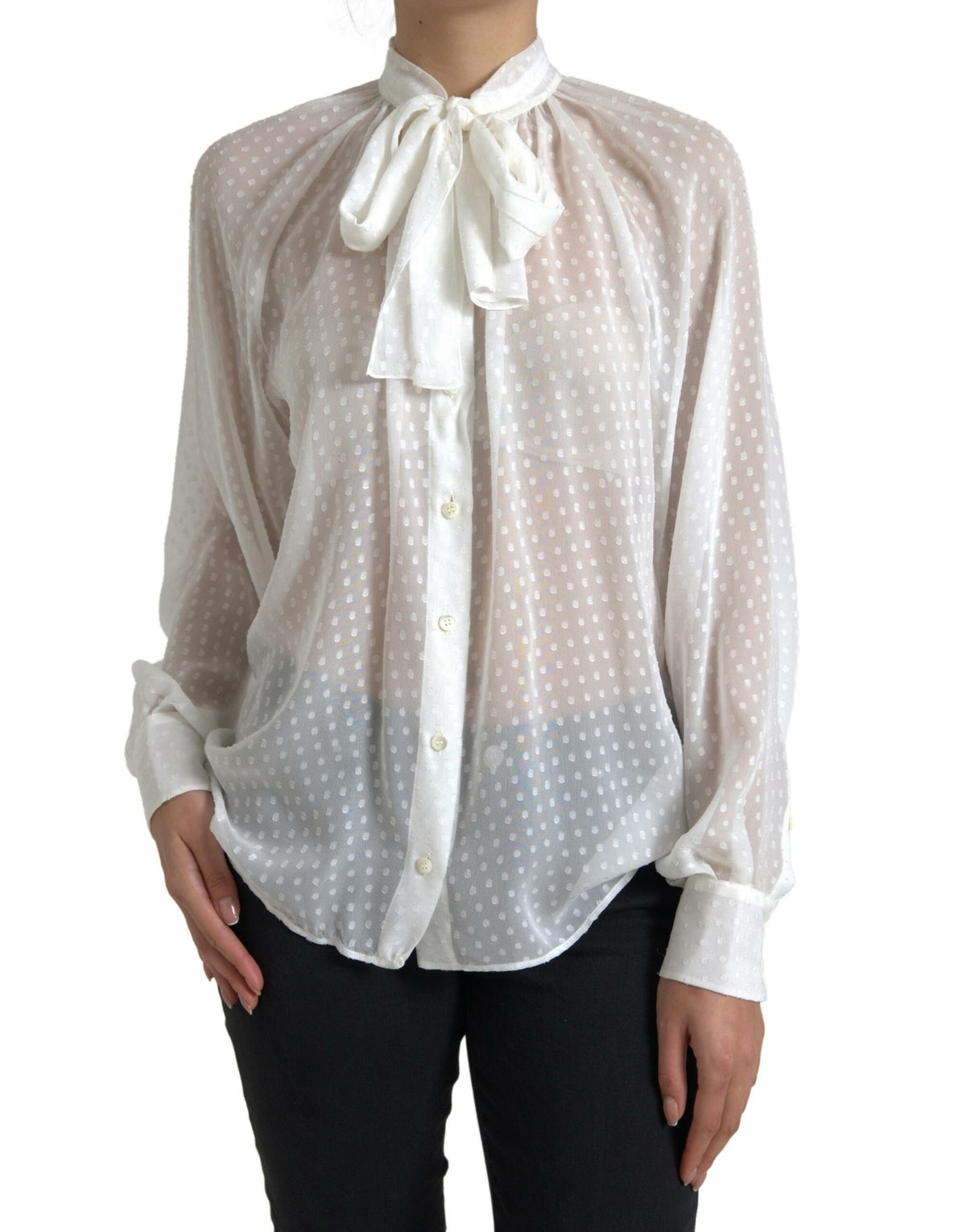 White silk sheer blouse with tied neck and polka dot pattern by Dolce & Gabbana, featuring long sleeves and elegant design.