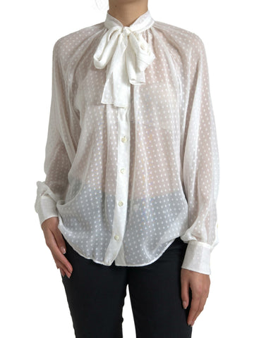 White silk sheer blouse with tied neck and polka dot pattern by Dolce & Gabbana, featuring long sleeves and elegant design.