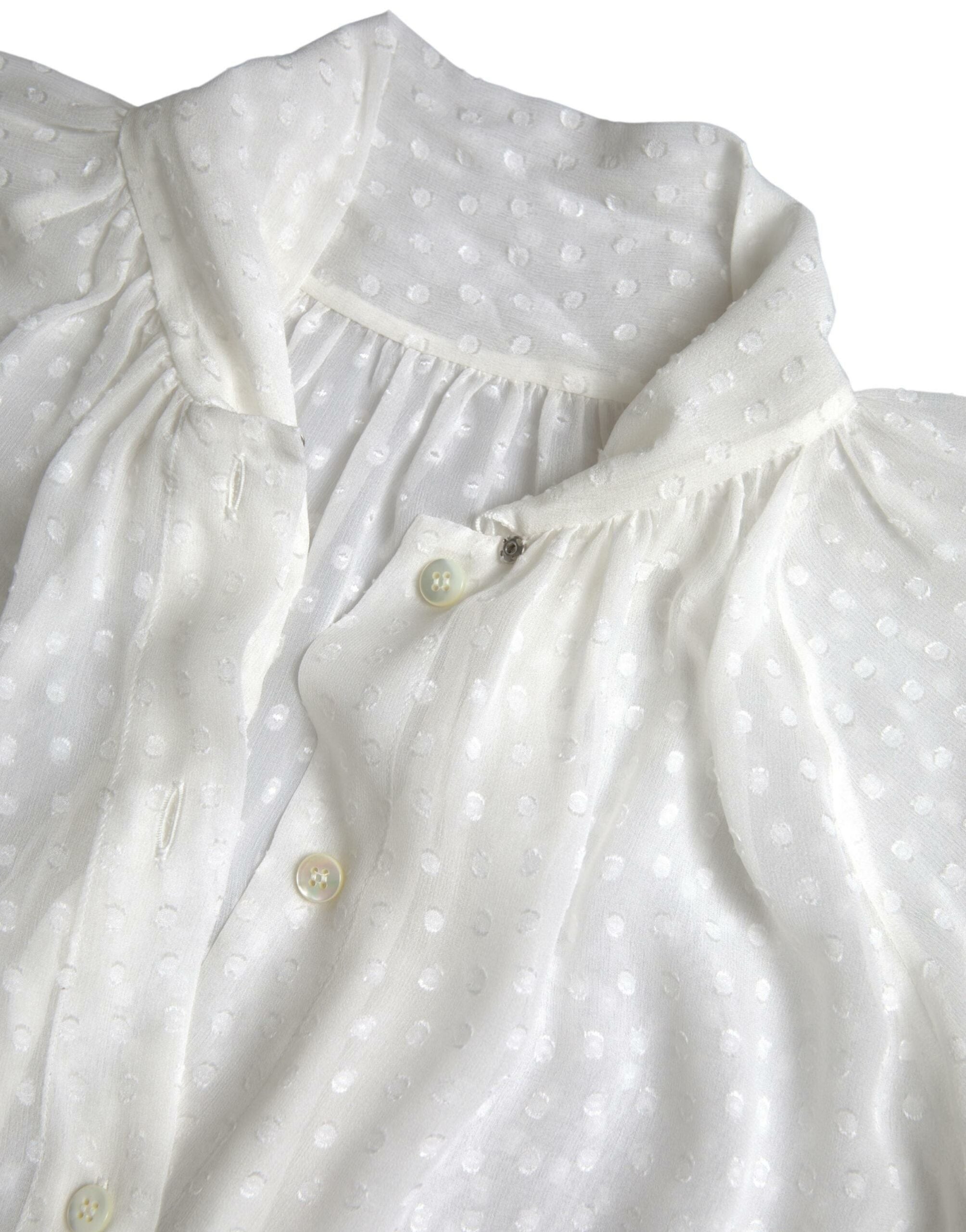 White silk sheer blouse with tied neck and polka dot pattern by Dolce & Gabbana, featuring long sleeves and elegant design