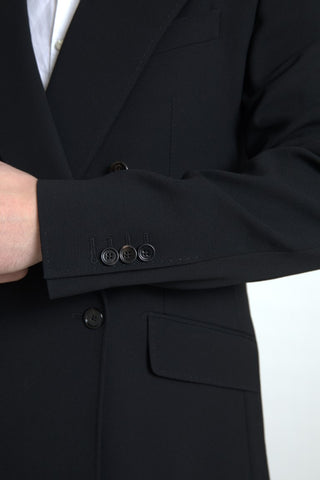 Black Dolce & Gabbana Sicilia 2-piece double-breasted suit, tailored blazer and matching trousers on a hanger.