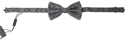 Black and white patterned adjustable neck bow tie by Dolce & Gabbana, featuring elegant papillon style and classic design.