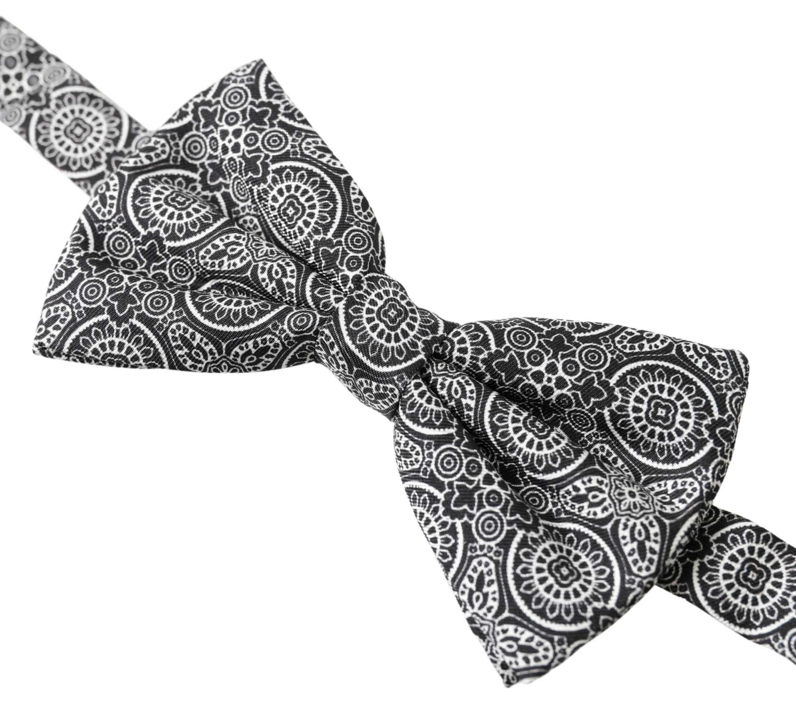 Black and white patterned adjustable neck bow tie by Dolce & Gabbana, featuring a classic papillon style with elegant design.
