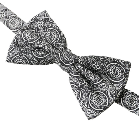 Black and white patterned adjustable neck bow tie by Dolce & Gabbana, featuring a classic papillon style with elegant design.