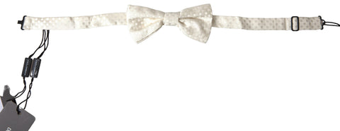 Ivory fantasy pattern adjustable neck papillon bow tie by Dolce & Gabbana, featuring a stylish and elegant design.