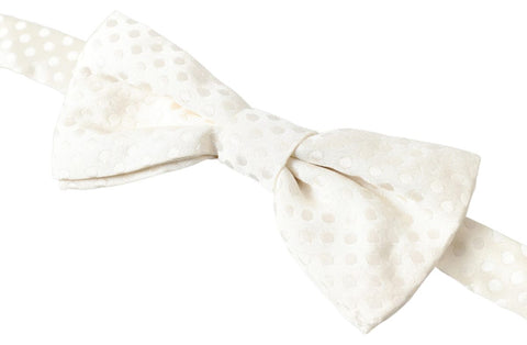 Ivory fantasy pattern adjustable neck papillon bow tie by Dolce & Gabbana, featuring elegant design and classic style.