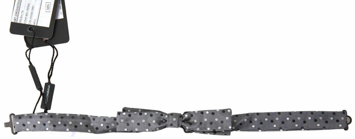 Gray silk polka dot men's adjustable bow tie with a papillon style, featuring a classic design from Dolce & Gabbana.