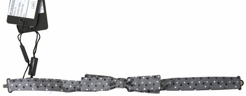 Gray silk polka dot men's adjustable bow tie with a papillon style, featuring a classic design from Dolce & Gabbana.