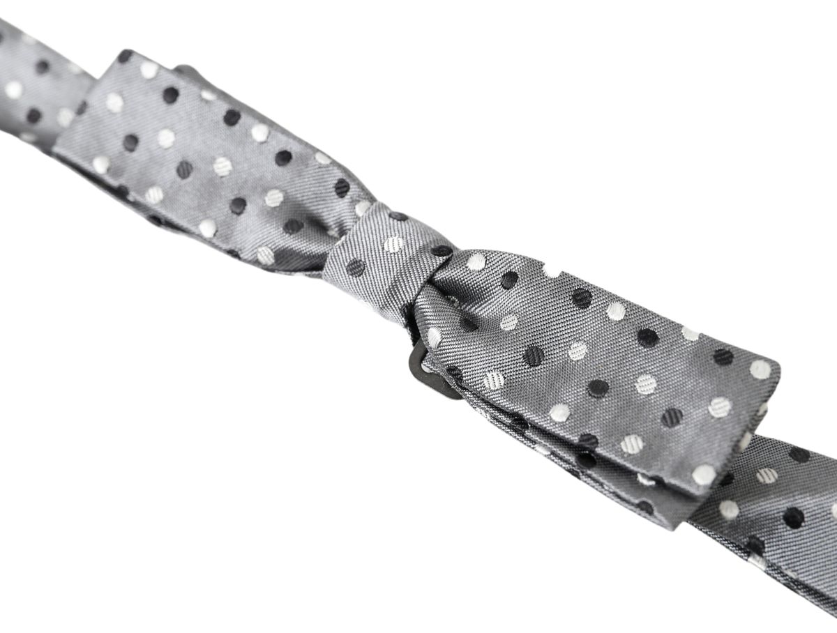 Gray silk polka dot men's adjustable bow tie with papillon style by Dolce & Gabbana, featuring a classic polka dot pattern.