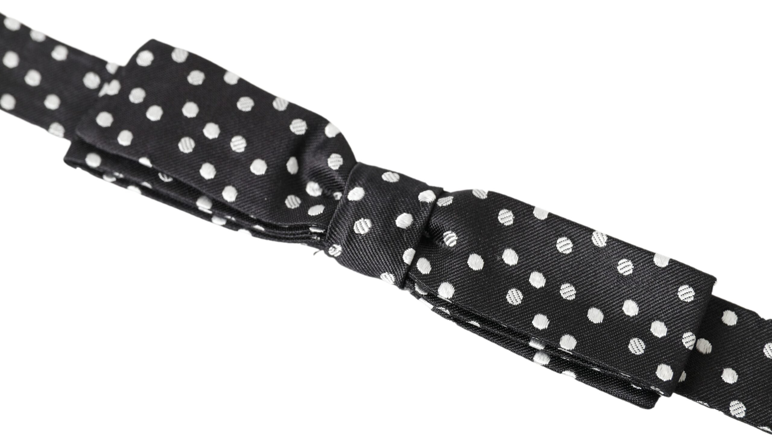 Black polka dot silk adjustable men's bow tie with a papillon style, by Dolce & Gabbana, shown on a white background.