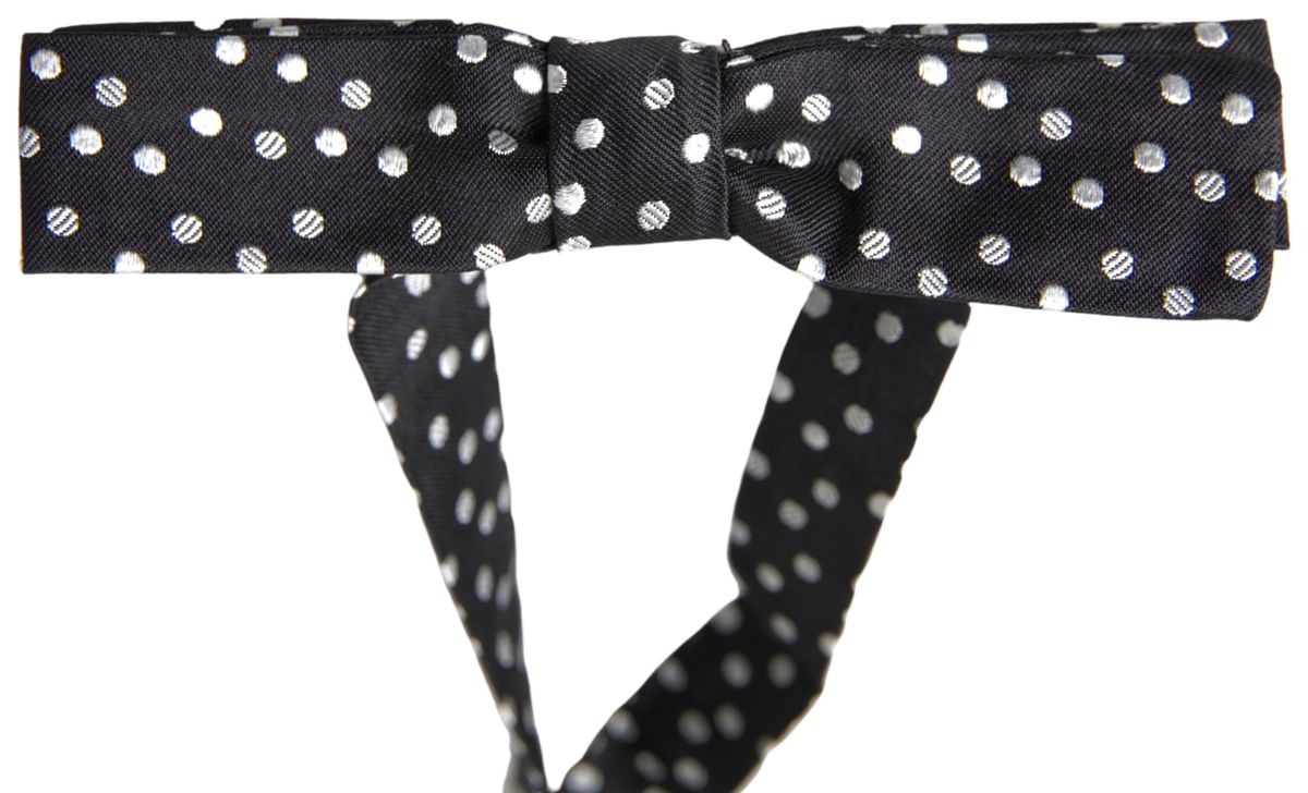 Black polka dot silk adjustable men's neck bow tie by Dolce & Gabbana, featuring a classic butterfly shape and elegant design.
