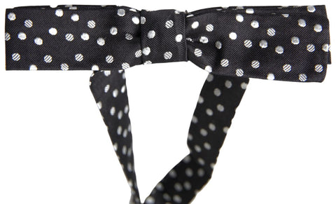 Black polka dot silk adjustable men's neck bow tie by Dolce & Gabbana, featuring a classic butterfly shape and elegant design.