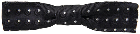 Black silk polka dot men's adjustable bow tie with papillon style, designed by Dolce & Gabbana, shown in the image.