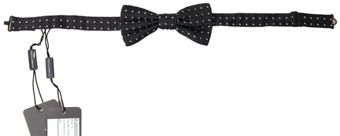 Black polka dot silk adjustable men's bow tie by Dolce & Gabbana, featuring a classic papillon style and elegant design.