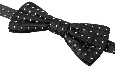 Black polka dot silk adjustable men's bow tie with a papillon style, crafted by Dolce & Gabbana.