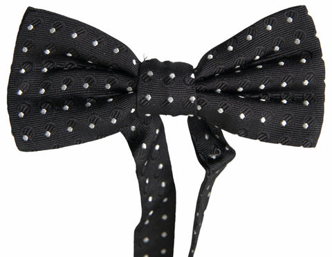 Black polka dot silk adjustable men's bow tie with a papillon style, from Dolce & Gabbana, featuring a classic and elegant design.
