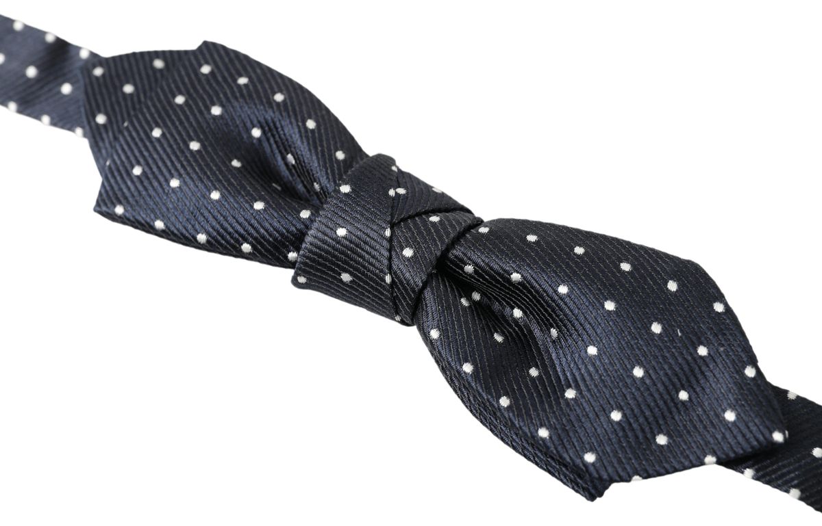 Blue polka dot silk adjustable men's bow tie with papillon style, designed by Dolce & Gabbana.