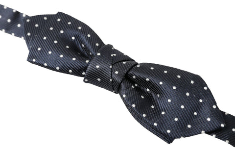 Blue polka dot silk adjustable men's bow tie with papillon style, designed by Dolce & Gabbana.