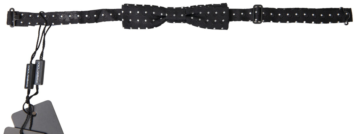 Black polka dot silk adjustable men's bow tie with a papillon style, designed by Dolce & Gabbana.