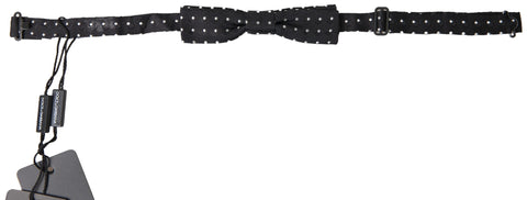 Black polka dot silk adjustable men's bow tie with a papillon style, designed by Dolce & Gabbana.