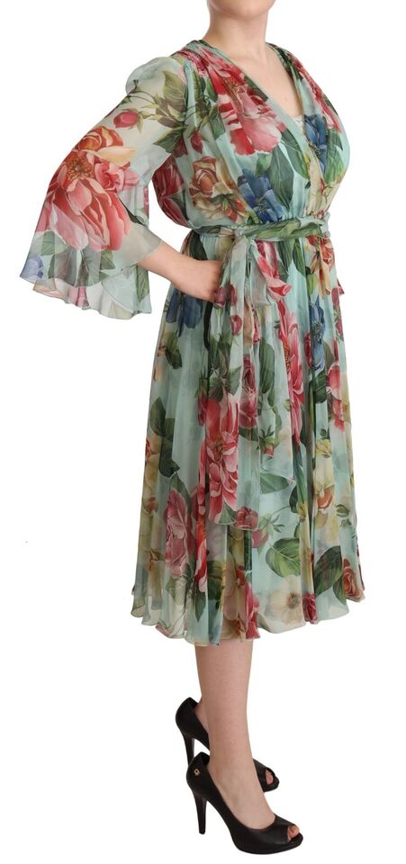 Multicolor green floral silk wrap midi dress by Dolce & Gabbana displayed on a hanger with vibrant pattern and elegant design.