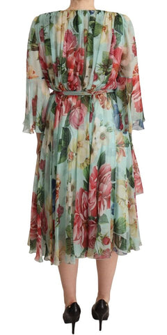 Multicolor green floral silk wrap midi dress by Dolce & Gabbana, shown with a flowing silhouette and vibrant floral pattern.