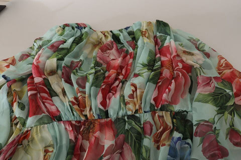 Multicolor green floral silk wrap midi dress by Dolce & Gabbana with a fitted waist and flowing skirt.