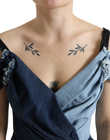 Blue patchwork two-tone denim mini dress by Dolce & Gabbana with a fitted silhouette and stylish design.