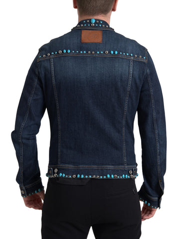 Blue denim Dolce & Gabbana jacket with turquoise stones and studded detailing, showcasing stylish embellishments and casual design.