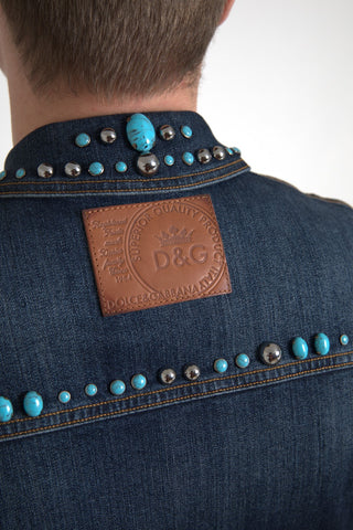 Blue denim jacket by Dolce & Gabbana with turquoise stones and studded detailing, showcasing a stylish and vibrant design.