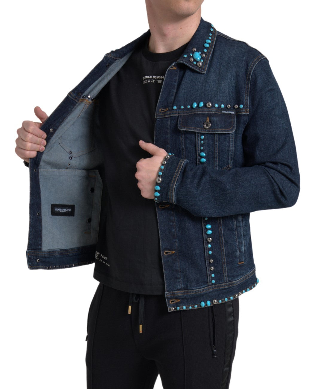 Blue denim Dolce & Gabbana jacket with turquoise stones and studded embellishments, featuring a stylish, contemporary design.
