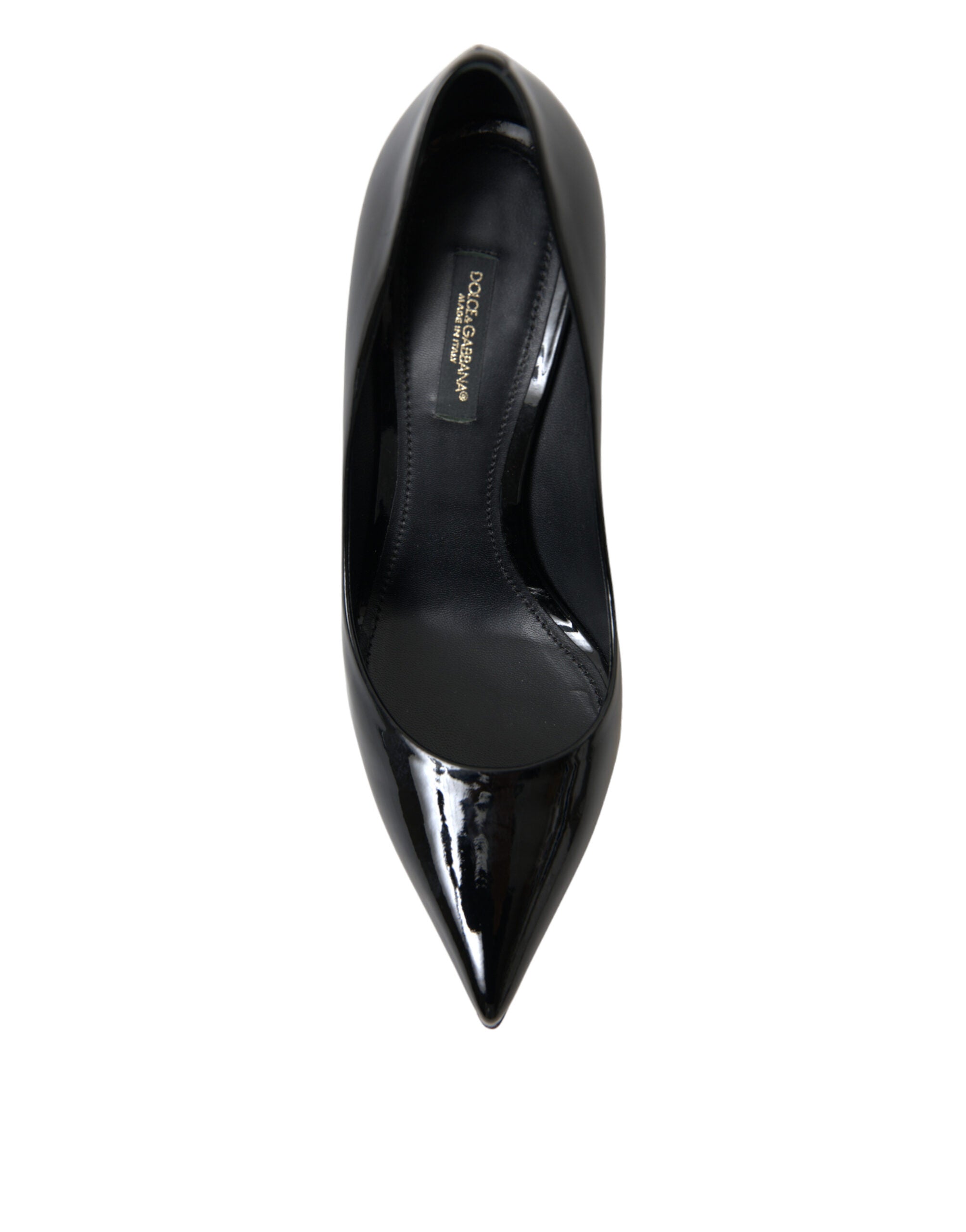 Black patent leather pump heels by Dolce & Gabbana, stylish women's shoes with pointed toes and high stiletto heels.