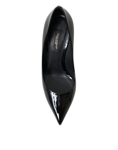 Black patent leather pump heels by Dolce & Gabbana, stylish women's shoes with pointed toes and high stiletto heels.