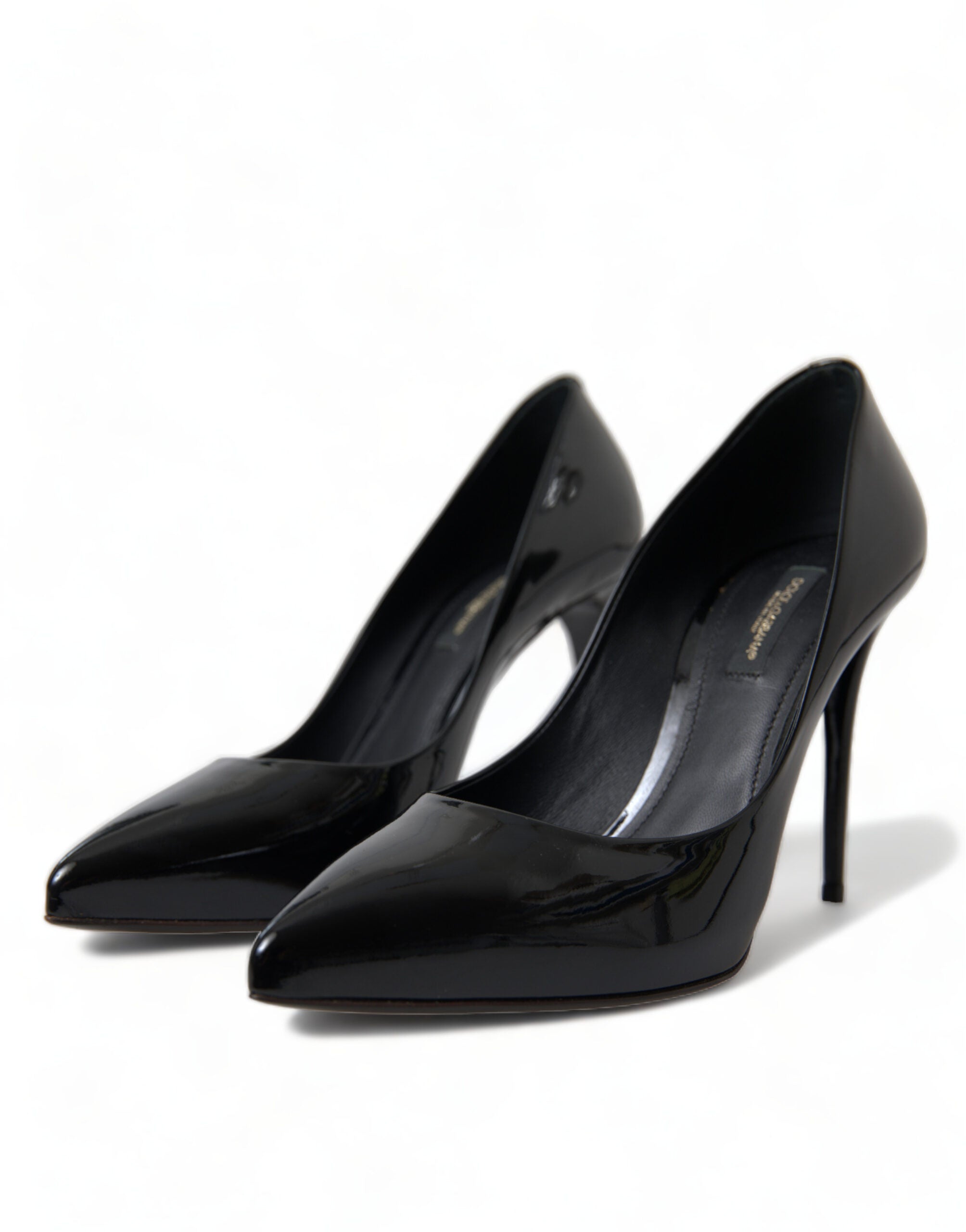 Black patent leather pumps with high heels from Dolce & Gabbana, showcasing elegant pointed toe design.