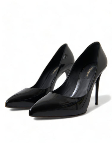 Black patent leather pumps with high heels from Dolce & Gabbana, showcasing elegant pointed toe design.
