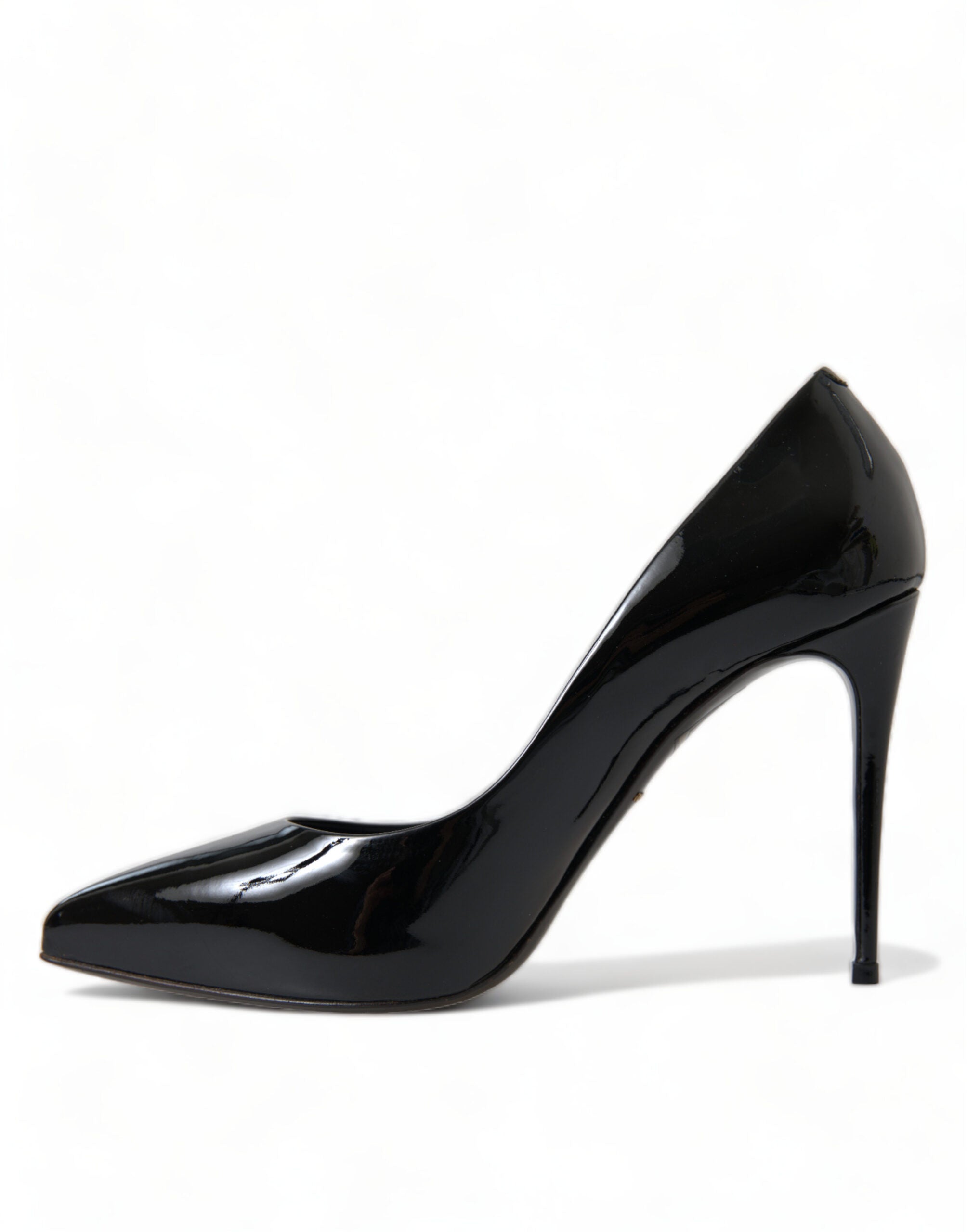 Black patent leather pumps heels shoes by Dolce & Gabbana, showcasing sleek pointed-toe design and glossy finish.