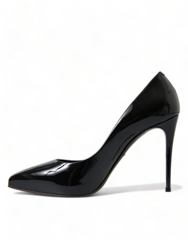Black patent leather pumps heels shoes by Dolce & Gabbana, showcasing sleek pointed-toe design and glossy finish.