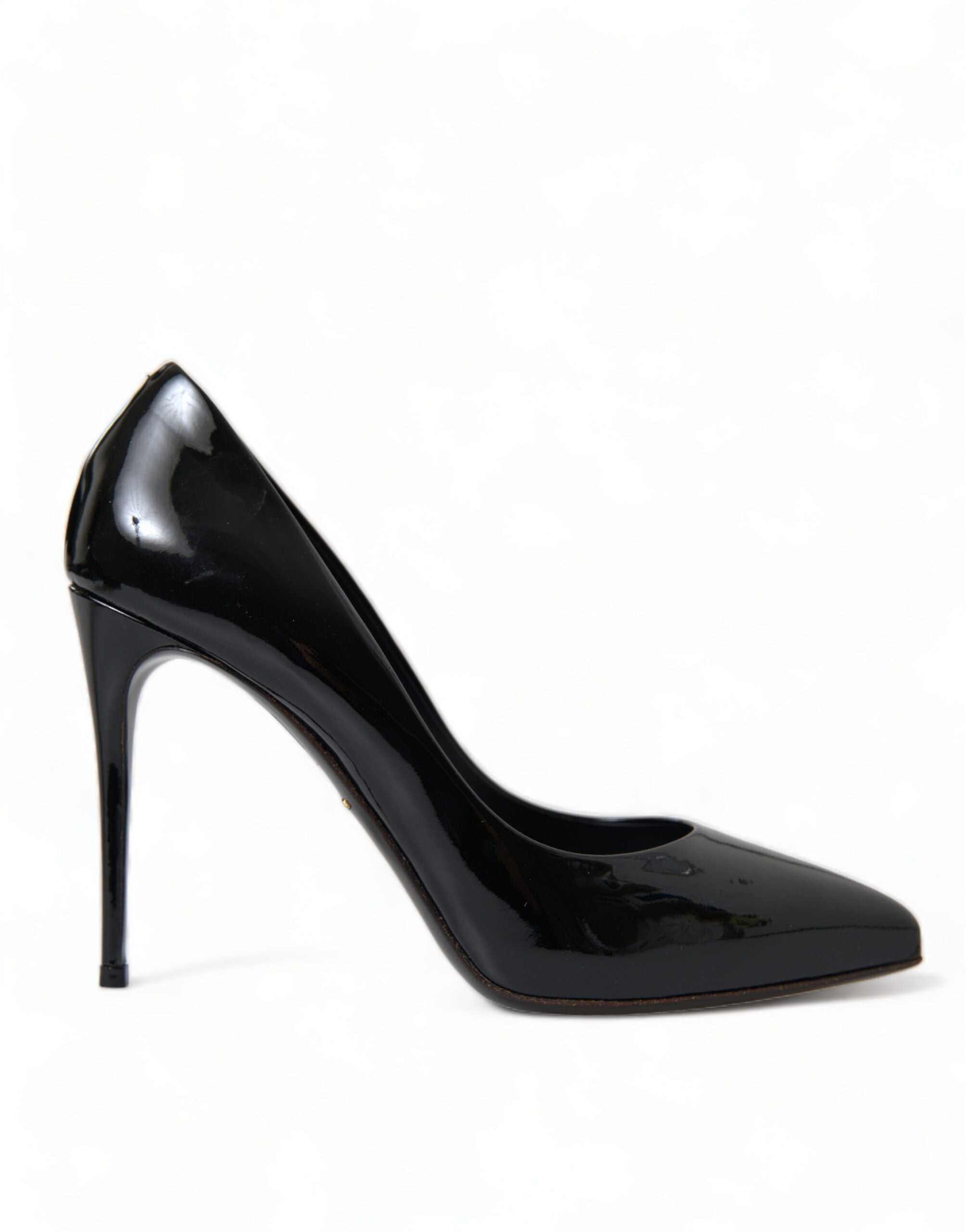 Black patent leather Dolce & Gabbana pumps with high heels and pointed toes, stylish footwear for formal or evening wear.