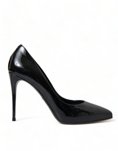 Black patent leather Dolce & Gabbana pumps with high heels and pointed toes, stylish footwear for formal or evening wear.