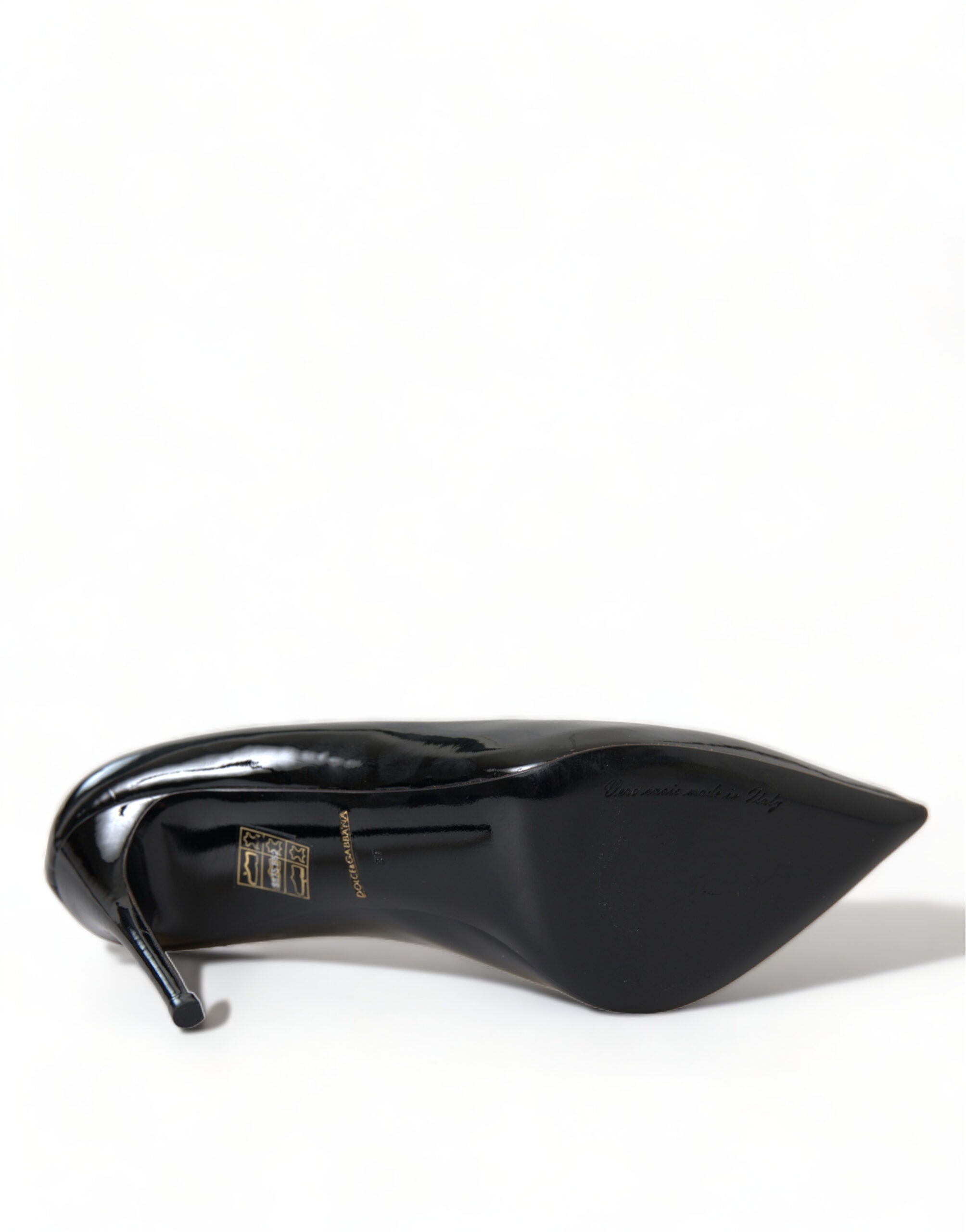 Black patent leather Dolce & Gabbana pumps with high heels and pointed toes, stylish and elegant footwear for women.